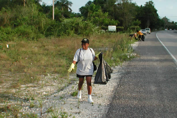 Volunteers Clean-Up Roadside Entrance to Negril - Negril Travel Guide